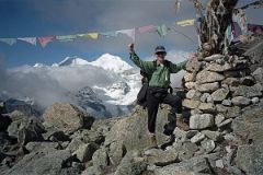 
Jerome Ryan arrived at the Langma La (5330m) and Chris took my photo next to the chorten and prayer flags that mark the high pass.
